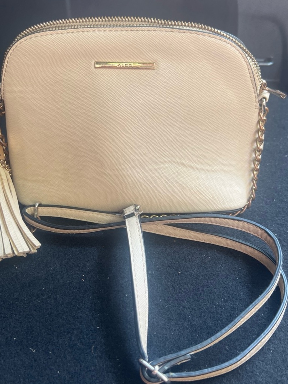 Aldo Beige Crossbody Bag with Tassel and Gold Accents
